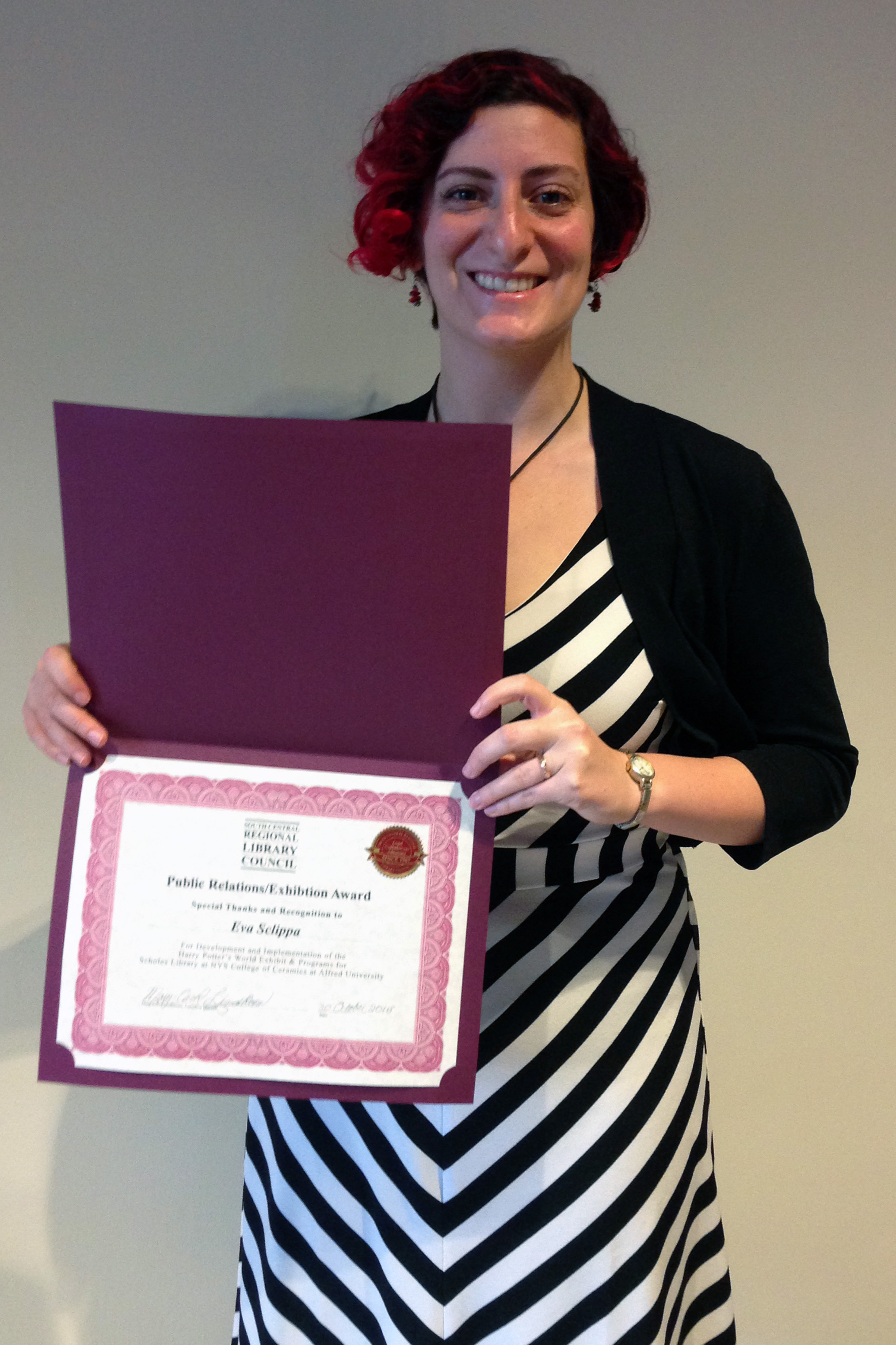 Eva Sclippa with her award from the SCRLC