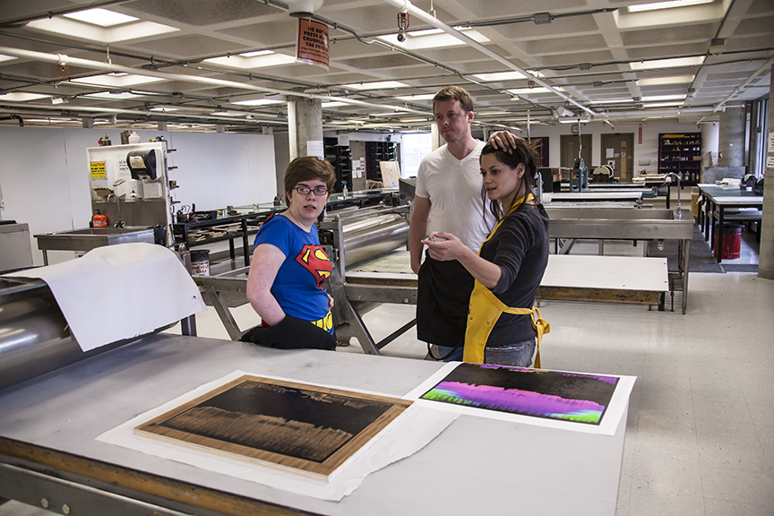 Jax and Kyle discussing their work with a pair of students of the NYSCC.