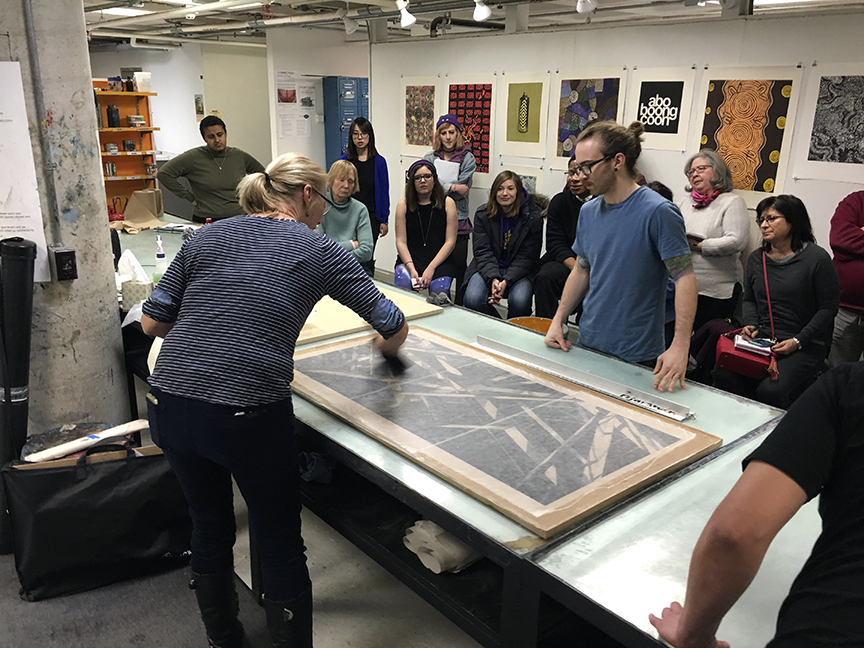A larger scale demonstration of collé printing on Japanese and Chinese papers. NYSCC print technician Tim Pauszek assists Jenny with her demonstration